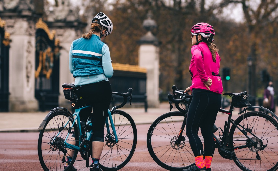 Two women with road bikes in London